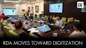 Rawalpindi Development Authority officials discuss digital property transfers and QR-coded allotment records.